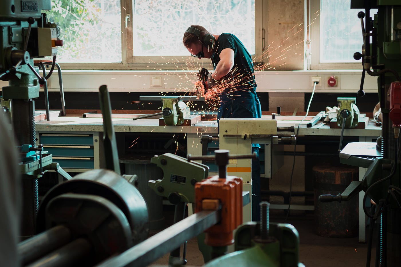 Grinding metal with an angle grinder - by Maxime Agnelli on Unsplash